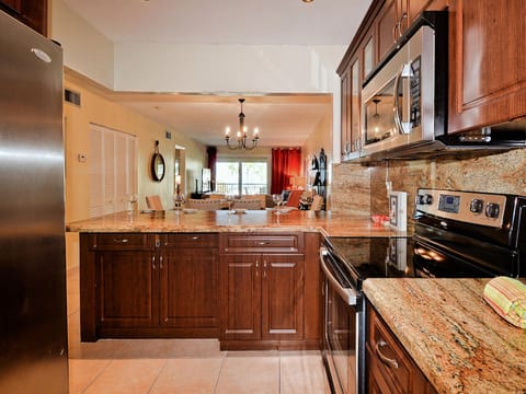 Granite counters and stainless steel appliances in the kitchen.