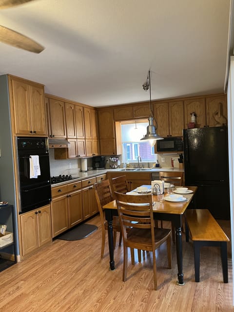 Dinning table that seats 6, gas stove/oven, dishwasher and refrigerator freezer