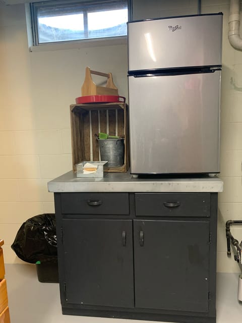 Downstairs refridge to store cool beverages to go on to the deck.