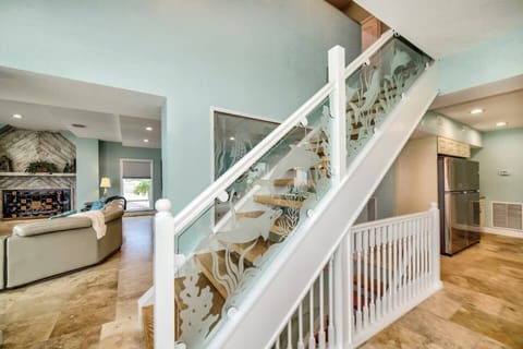 Light up staircase to the top floor - two king rooms on the main floor with bathrooms.