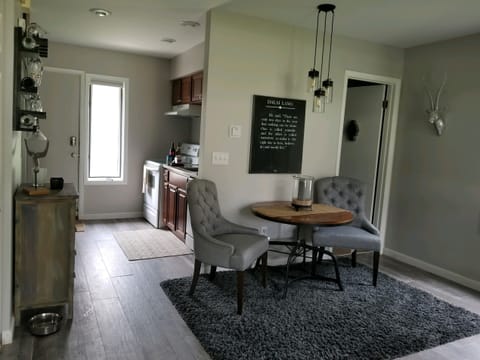 View of Dining table with Bathroom to the Right