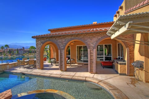 Patio view from spa, bar area, fire table and chairs