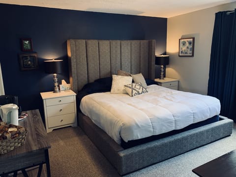 King size bed with personal bathroom, coffee bar, writing desk, refrigerator 