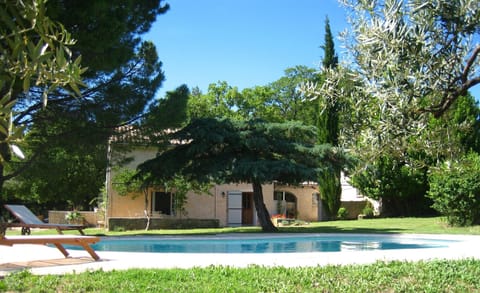 Main view of the pool and front side of the house