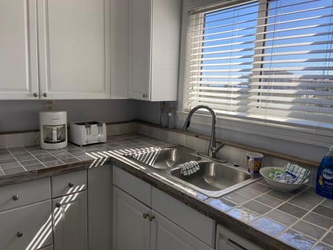 Bright kitchen with ample natural light and modern appliances
