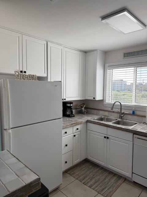 Bright, airy kitchen with modern appliances and scenic window views