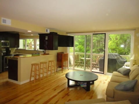 Open kitchen, dining & living area w/ balcony, HD TV, cable, DVD player & Wi-Fi