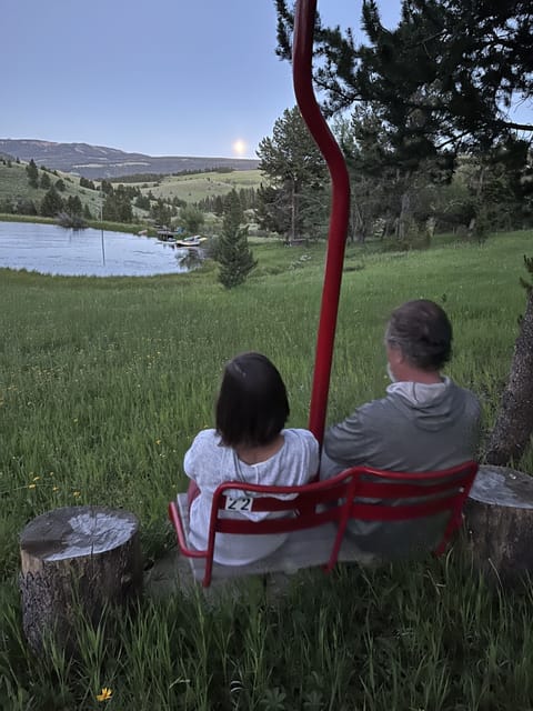 Swinging chairlift overlooking the pond