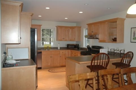 Bright kitchen - separate dining area- porch overlooking Lake Sunapee