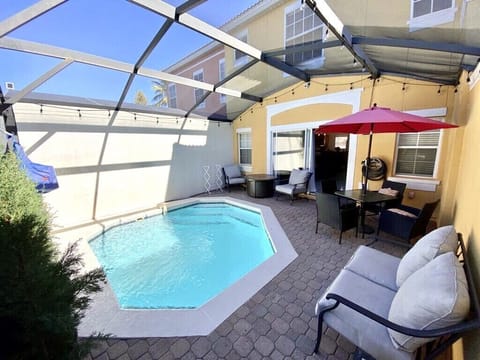 Patio with a heated pool