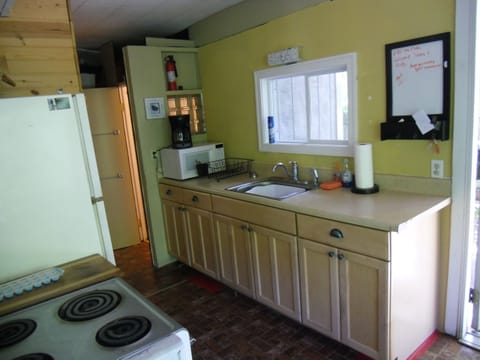 Kitchen stocks dishes , pots pans, Mr Coffee, microwave, full size range &Refri