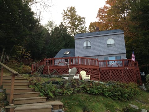 Front view facing water, landscaped yard, steps to dock 1. 
