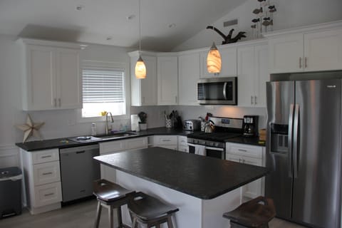 Well Stocked Kitchen with Sturdy Swivel Bar Stools!  Settings for 24!
