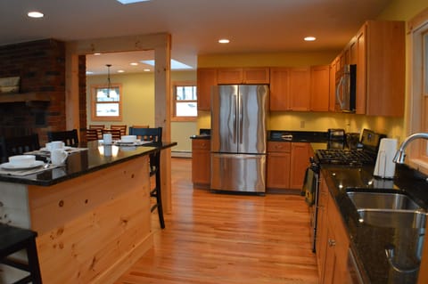 This kitchen features granite countertops and stainless steel appliances. 