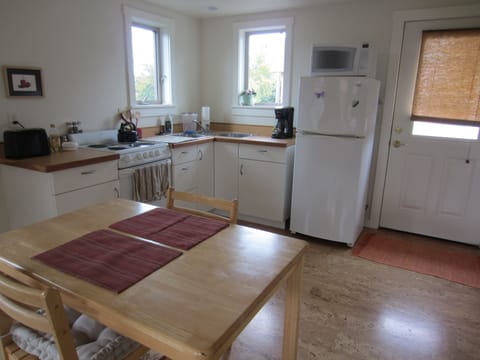 Kitchen comes with basics, plates, glasses, cutlery, knives, salad spinner. 