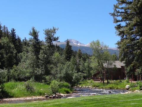 View from backyard, deck, and living room looking up river at Longs Peak