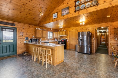 Kitchen with new stove and refrigerator and plenty of countertop space 
