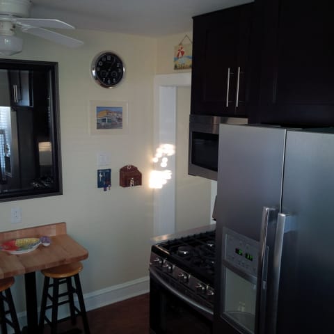 Kitchen complete with ice maker, gas stove with griddle and microwave