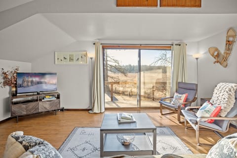 Living room. Looking from couch out front balcony.