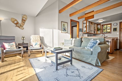 Living room. Looking from TV/media stand toward kitchen and bedroom.