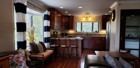 Spacious living room open to well appointed kitchen