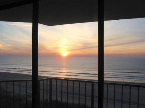 View of the sunrise from the living room through the sliding glass doors 