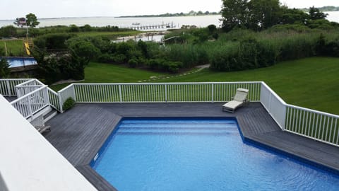 Pool and view from upstairs bedroom balcony