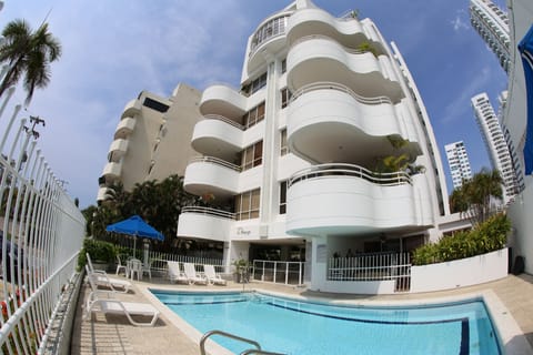 Building and pool that is directly accessed from condo patio   