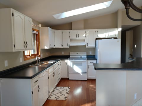 Kitchen fully equipped with everything you need to cook yourself or order in.