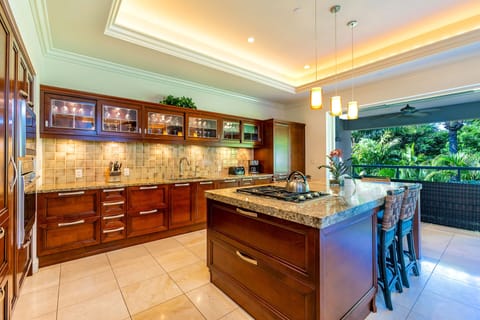Beautiful kitchen with dual refrigerators and bar top island