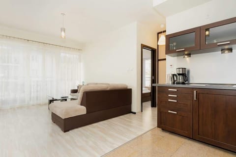 Another view of the living room, highlighting the open floor plan and proximity to the kitchen, giving a sense of spaciousness.