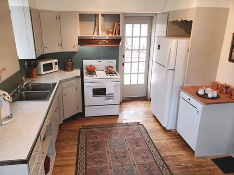 Spacious well stocked kitchen with access to patio