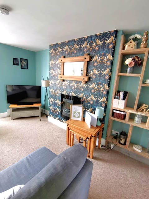 Large lounge and Tv with plenty of natural light