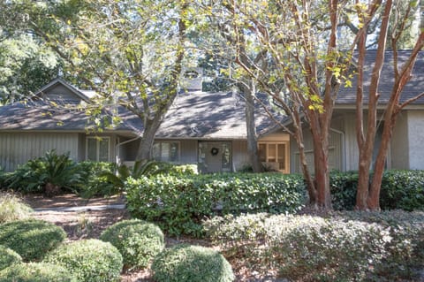 Near beach one story well kept home in lush greenery and Cougar golf course