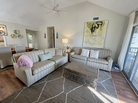Spacious den with pull out couch recently painted and new lvt flooring.  