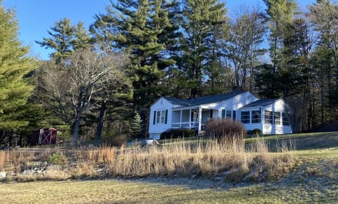  private woods behind house with open meadow in front