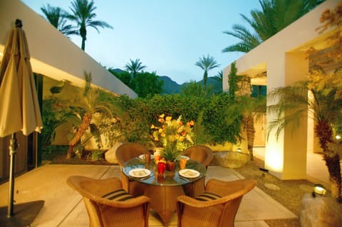Front courtyard dining, adjacent to kitchen and outdoor gas grill