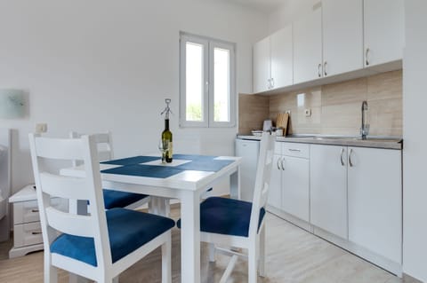 This is a seating or dining area and fully-equipped kitchen