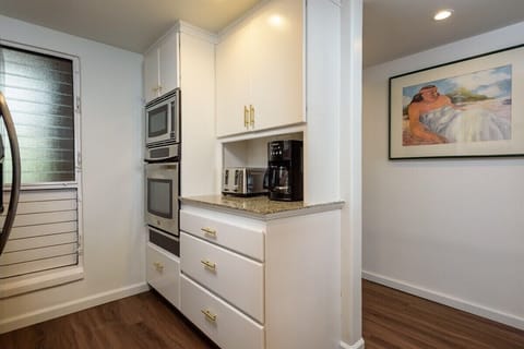 Ready for any meal! This kitchen, complete with small & large appliances, makes cooking a breeze.