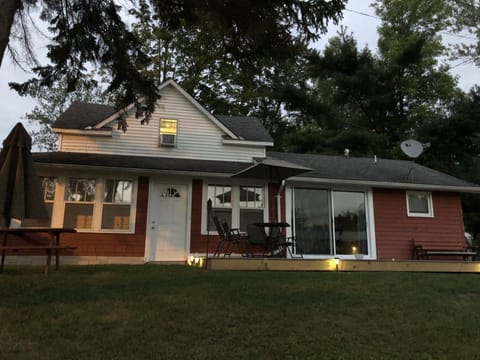 Sliding door from kitchen onto a canal facing deck.