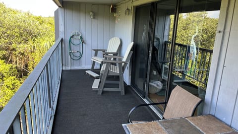 Balcony overlooking views to nature area connected to intracoastal waterway.