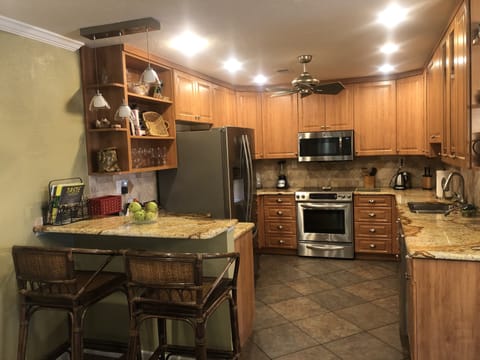 kitchen open to dining/living with breakfast bar.