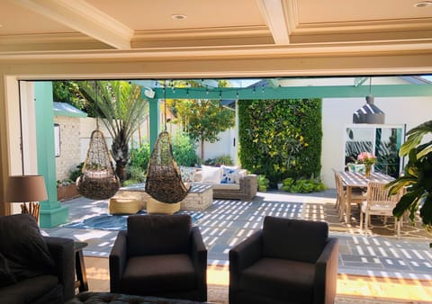 Indoor/outdoor living space with disappearing door. 