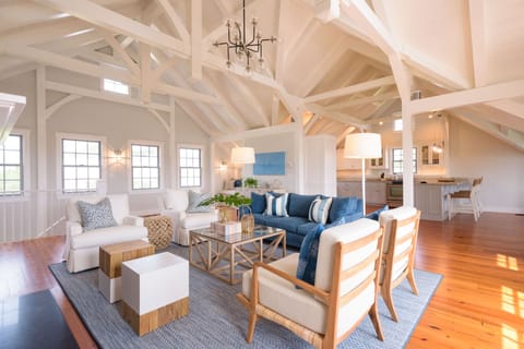 Upstairs living room featuring post & beam architecture