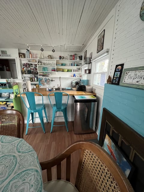 View from Bedroom looking at Kitchen and small refrigerator