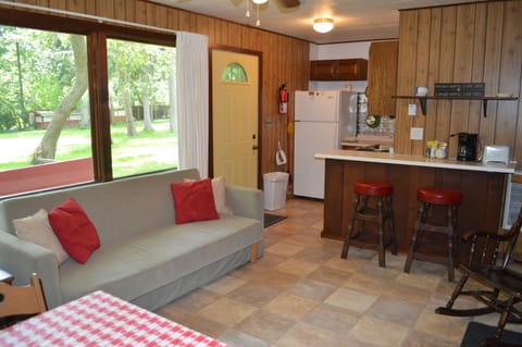 Living room and kitchen area of Cottage #2. Cottage #2 also has a foldout futon
