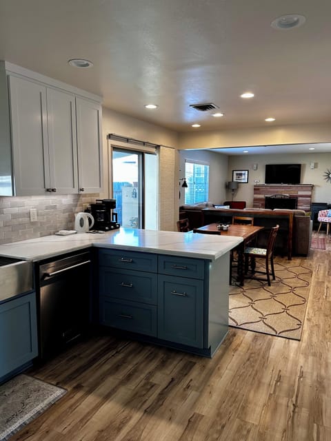 Kitchen overlooks dining area and family room for socializing.