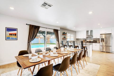 Designer custom kitchen, and beautiful 10-person dining tables.