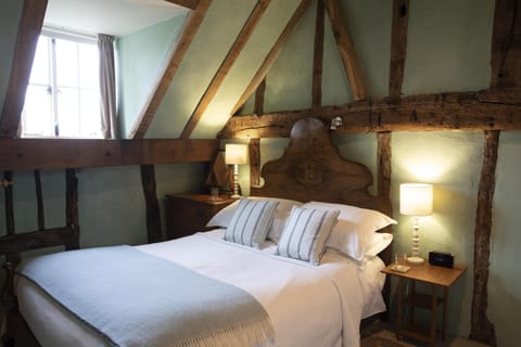 Vaulted beamed ceiling in bedroom