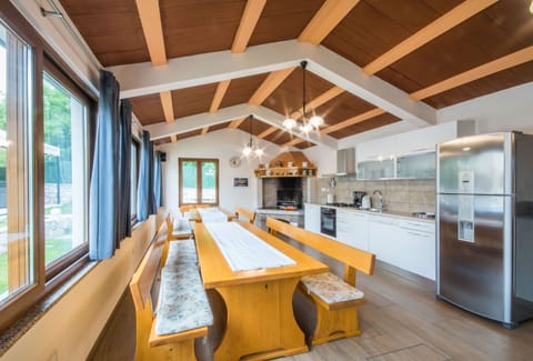 Large dining tables and a spacious kitchen
